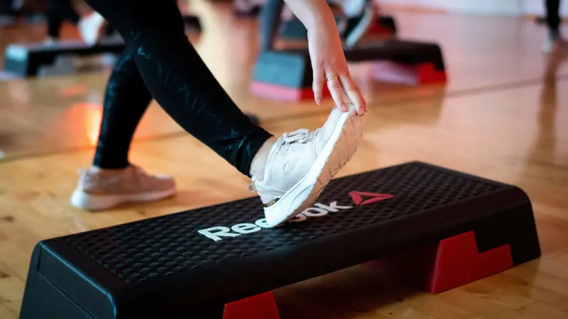 Fitness class showing the shift from aerobics trends to strength training for long-term health