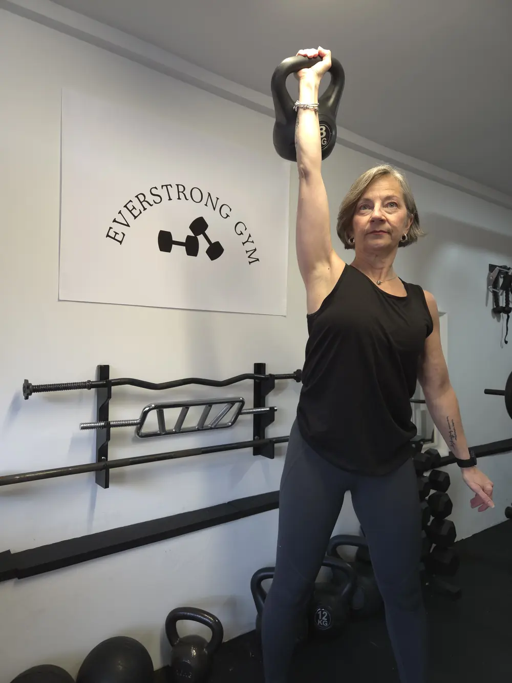 Liz Shaw personal trainer demonstrating kettlebell training at The Everstrong Gym, Ealing